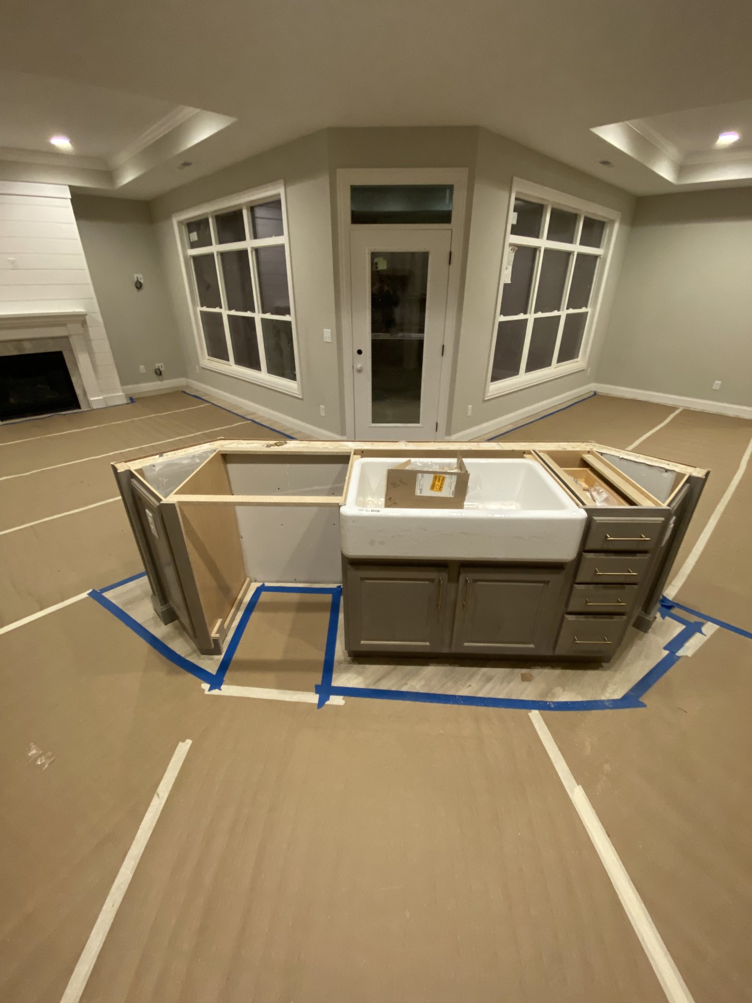 Island framed and cabinetry set in a bay-window kitchen