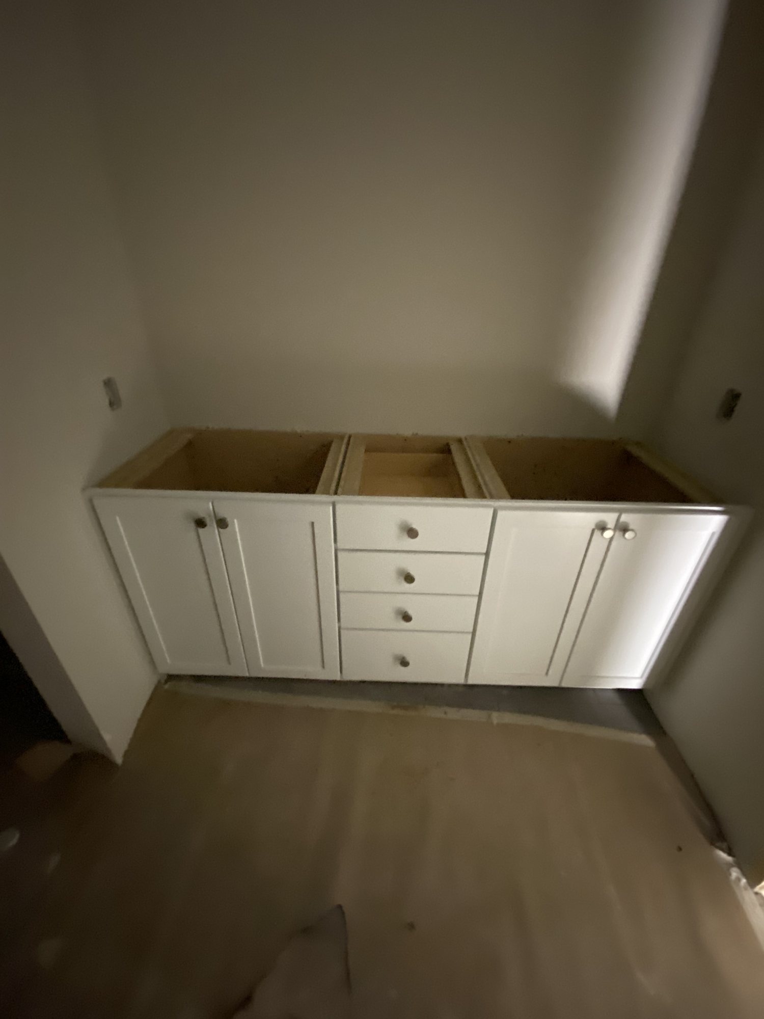 White vanity run set and levelled before the countertop